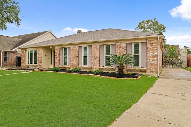 ranch-style home with a front lawn