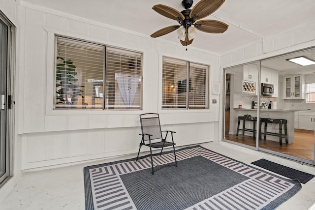 sunroom / solarium with ceiling fan