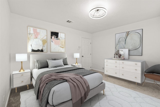 bedroom with light carpet and a textured ceiling