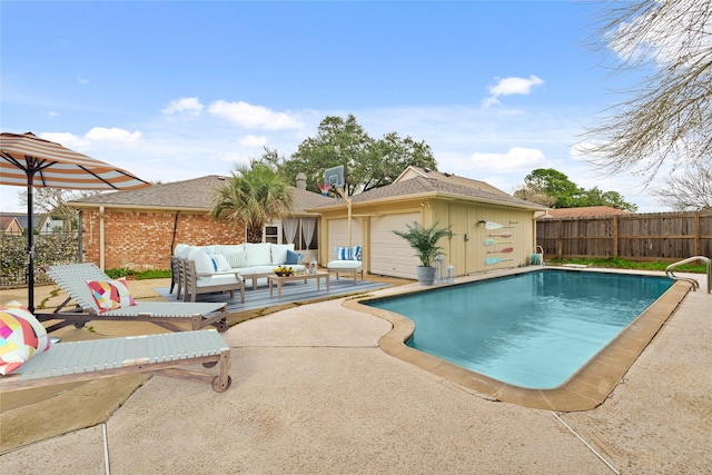 view of pool featuring a patio and an outdoor living space