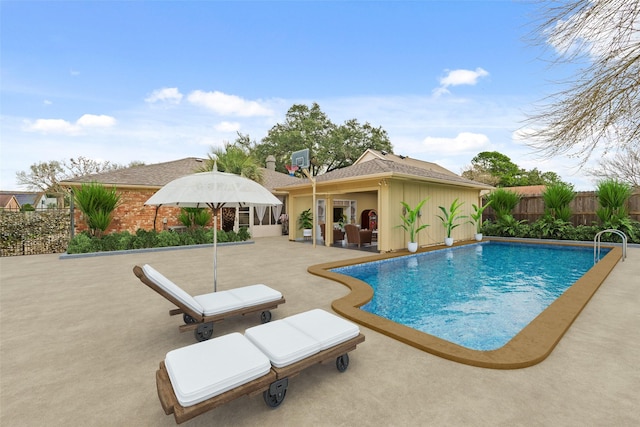 view of swimming pool featuring a patio area