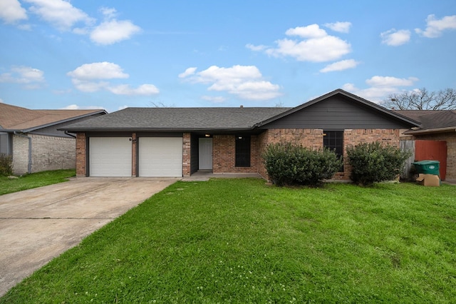 ranch-style house featuring a front lawn and a garage