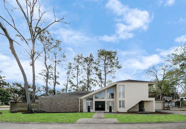 view of building exterior featuring driveway and a garage