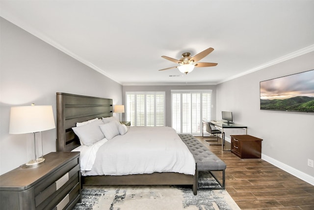 bedroom with baseboards, dark wood-type flooring, and crown molding