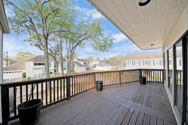 wooden deck featuring a residential view