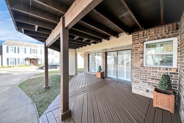 wooden terrace with a residential view