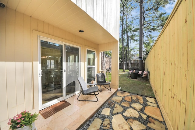 view of patio / terrace featuring fence