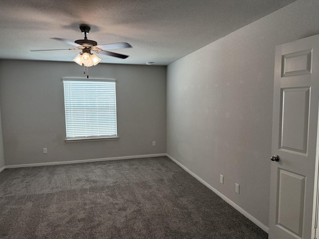 carpeted spare room featuring ceiling fan and a textured ceiling