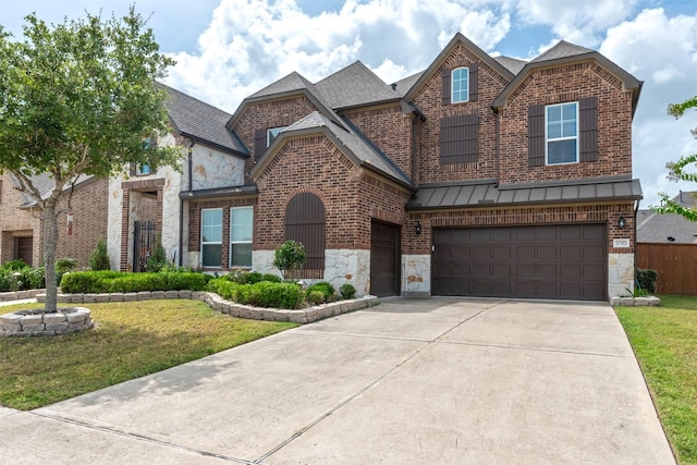 view of front of home with stone siding, brick siding, a standing seam roof, and concrete driveway