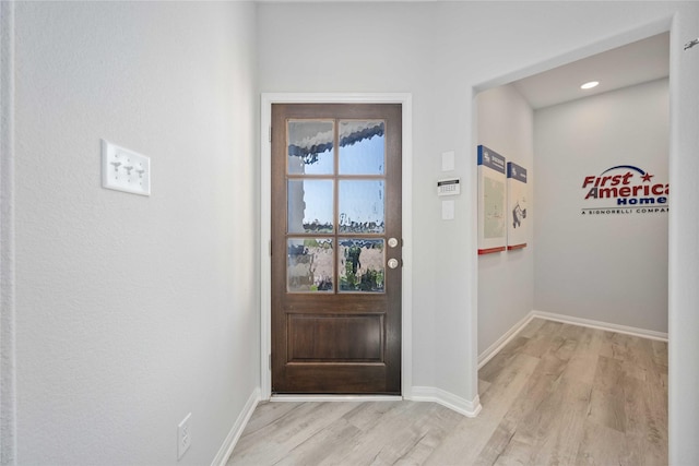 doorway featuring light wood-type flooring