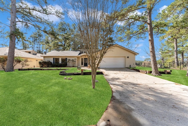 ranch-style home featuring a front yard and a garage