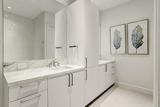 bathroom with tile patterned floors and vanity