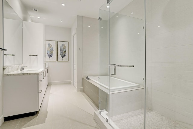 bathroom with tile patterned floors, vanity, and plus walk in shower