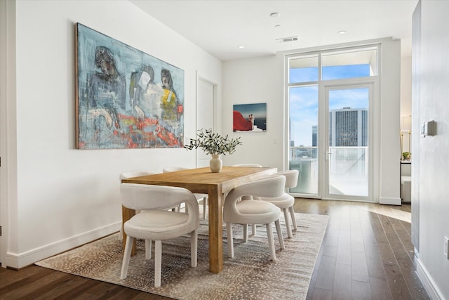 dining area with hardwood / wood-style floors