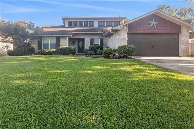 view of front of house featuring a front yard and a garage