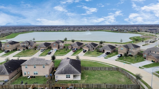 birds eye view of property featuring a residential view and a water view