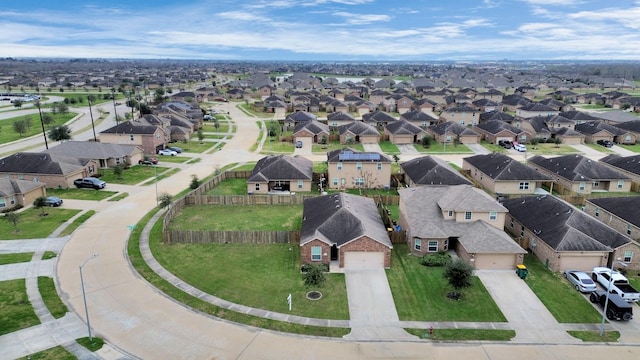 birds eye view of property with a residential view