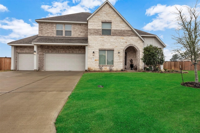 view of front of home featuring a front yard and a garage