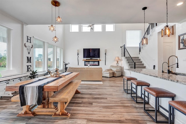 dining room with hardwood / wood-style floors and sink