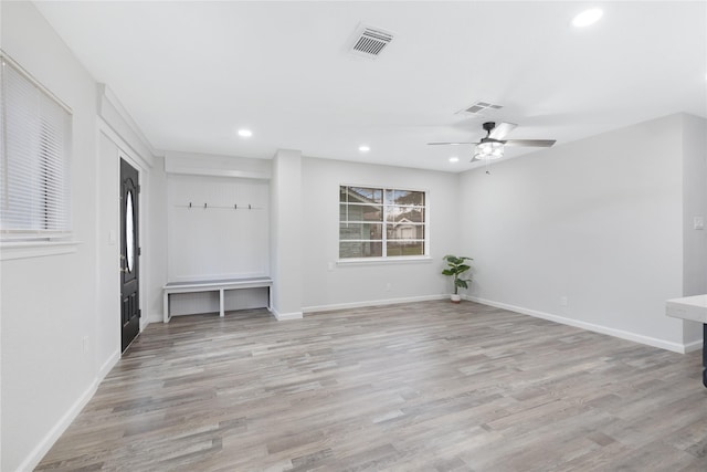 spare room with light hardwood / wood-style flooring and ceiling fan