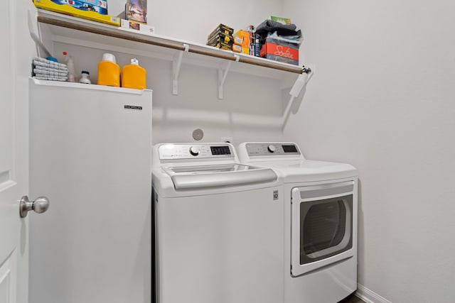 washroom featuring separate washer and dryer