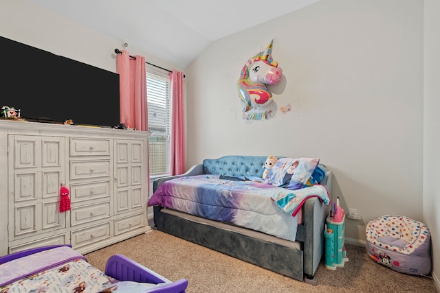 bedroom featuring vaulted ceiling and light colored carpet