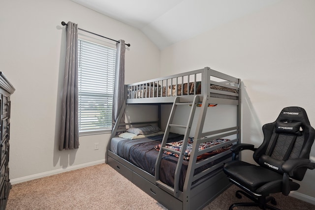 bedroom featuring carpet and vaulted ceiling