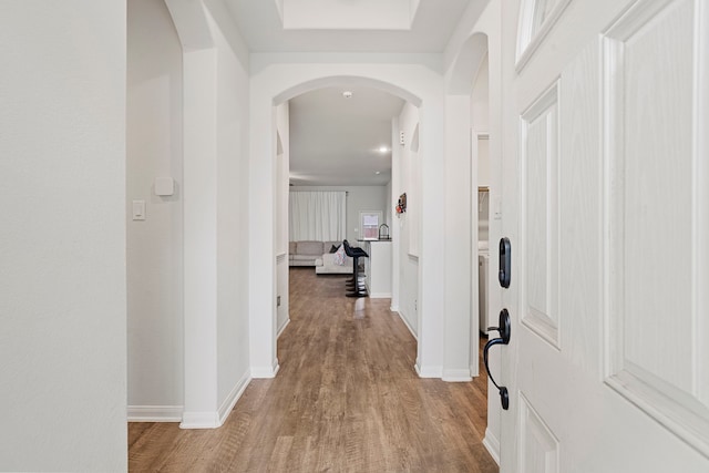 hall with light wood-type flooring