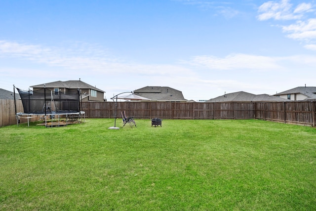 view of yard with a trampoline