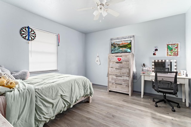 bedroom featuring light hardwood / wood-style flooring and ceiling fan