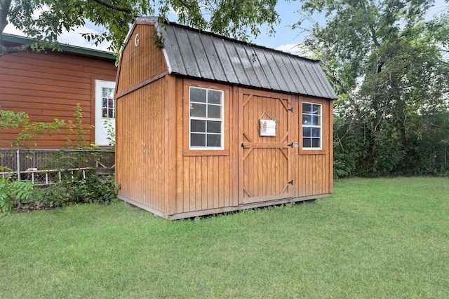 view of outdoor structure with a yard