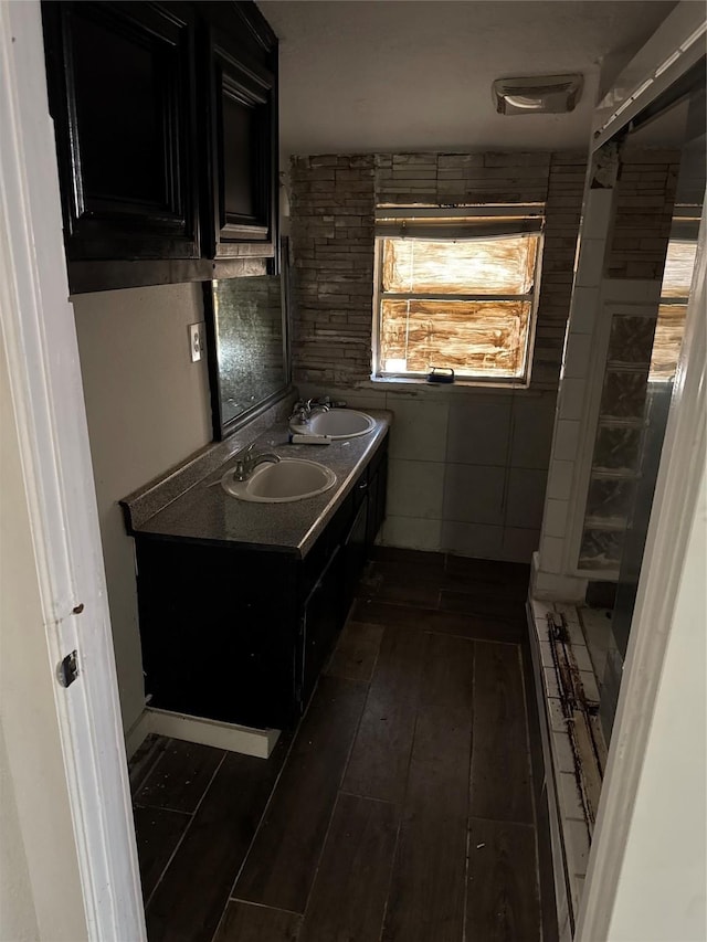 bathroom featuring hardwood / wood-style flooring and vanity