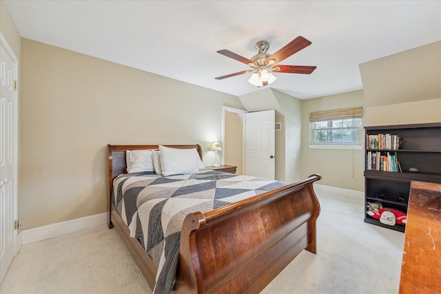 carpeted bedroom with lofted ceiling and ceiling fan