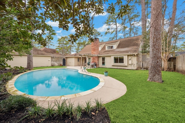 view of swimming pool featuring a lawn and a patio area