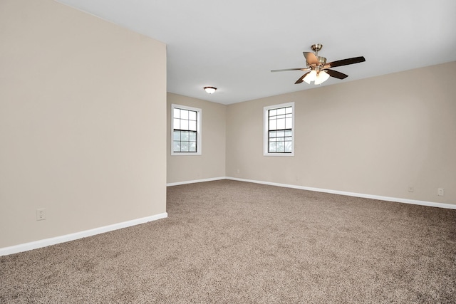 empty room with carpet and ceiling fan