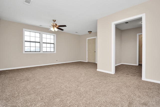 empty room featuring ceiling fan and carpet flooring