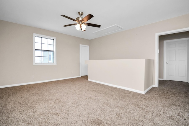 spare room featuring ceiling fan and carpet floors