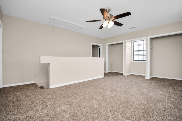 unfurnished bedroom featuring ceiling fan and carpet flooring