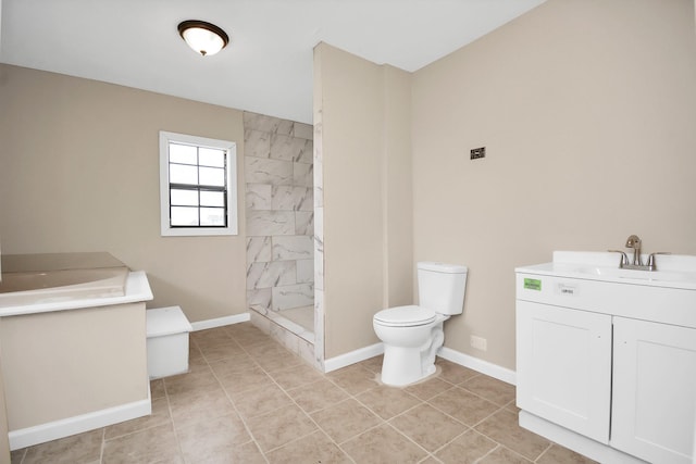 bathroom with vanity, tiled shower, toilet, and tile patterned floors