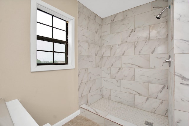 bathroom featuring tiled shower