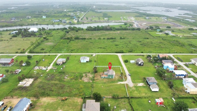 aerial view featuring a rural view and a water view