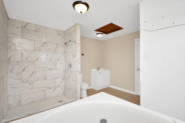 bathroom featuring sink, tiled shower, and toilet