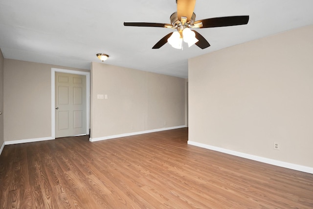 unfurnished room featuring hardwood / wood-style flooring and ceiling fan