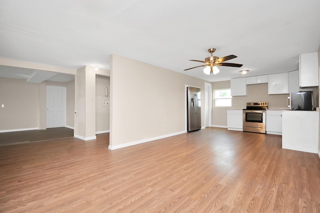 unfurnished living room with light hardwood / wood-style floors and ceiling fan