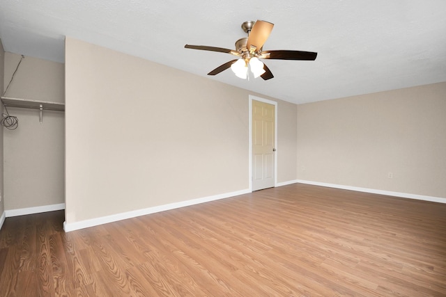 unfurnished bedroom featuring light wood-type flooring, a closet, and ceiling fan