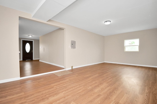 spare room featuring light wood-type flooring