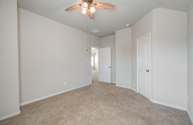 unfurnished bedroom with ceiling fan and light colored carpet