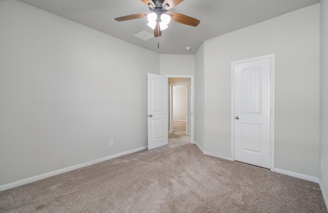 unfurnished bedroom with ceiling fan and light carpet