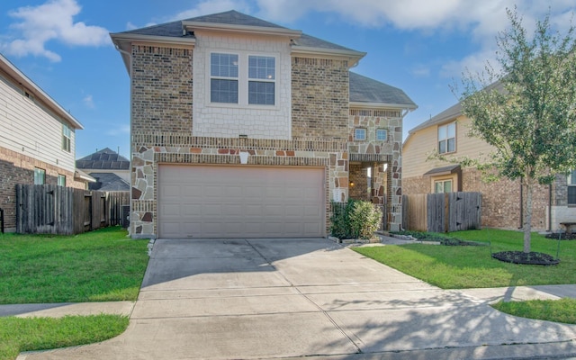 view of property with a garage and a front lawn