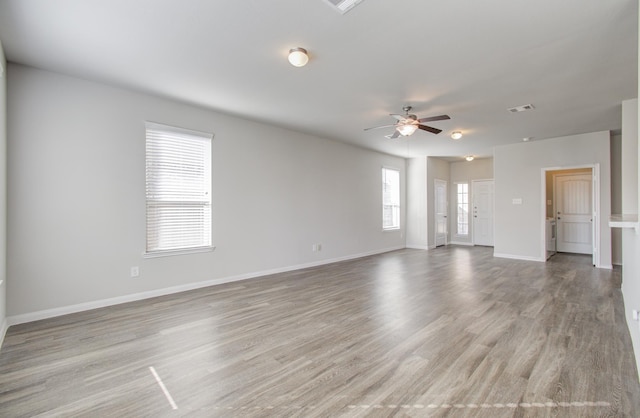 unfurnished living room with light hardwood / wood-style floors and ceiling fan